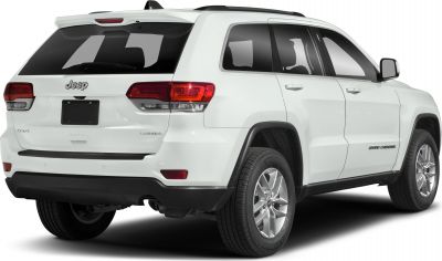 Rear side view of a white SUV with alloy wheels and distinctive taillights