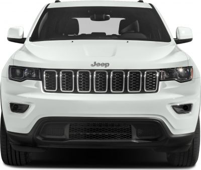 Front view of a white SUV with signature grille and headlights