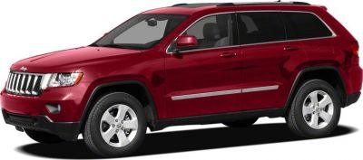 Red SUV with chrome grille and five-spoke alloy wheels side profile