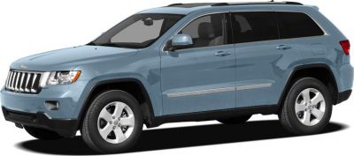 Side profile of a mid-size SUV with seven-slot grille and five-spoke wheels.