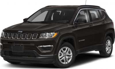 Front-side view of SUV with seven-slot grille and prominent headlights