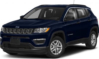 Front-right angled view of SUV with seven-slot grille and alloy wheels