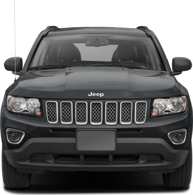Seven-slot front grille and dual headlights of a black SUV