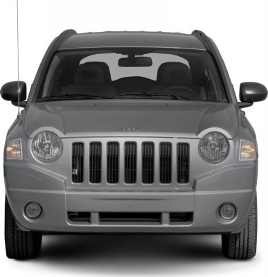 Front view showing distinctive seven-slot grille and round headlamps