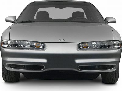 Dual headlights and smooth hood of a 1998-2002 sedan