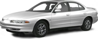 Sleek sedan front side view with distinct smooth body lines and chrome wheels.