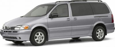 Silver minivan with sliding door and roof rails side profile