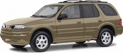 Side profile of an SUV with roof rack and tan paint