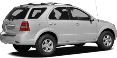 Rear side view of an SUV with roof rack and alloy wheels