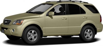 Side profile of beige midsize SUV with roof rails and alloy wheels