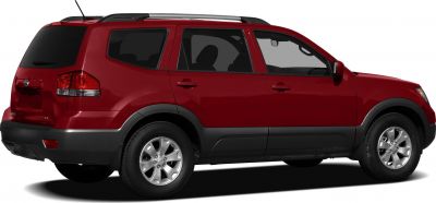 Side profile of large SUV with alloy wheels and roof rails.