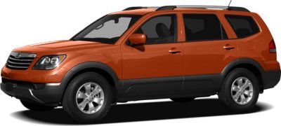 Orange mid-size SUV side view with roof rails and alloy wheels