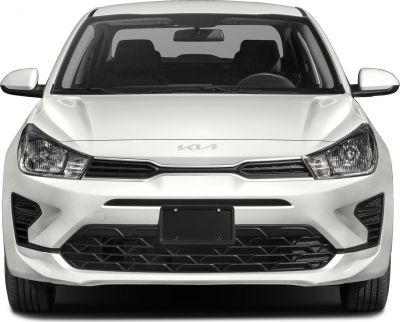 Front view of a sedan with distinctive grille and headlight design