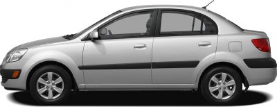 Side profile of a 2009 sedan with alloy wheels and black side molding
