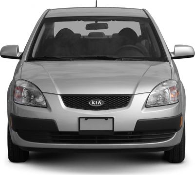 Silver sedan front view with grille and dual headlights