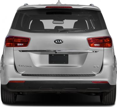 Rear view of minivan with taillights, rear windshield, and license plate area
