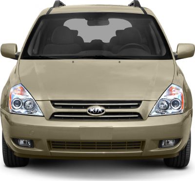 Front view with prominent headlights, grille, and fog lights
