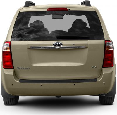 Rear view of minivan featuring tailgate, large rear window, and taillights