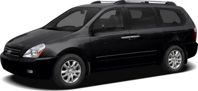 Side-front view of a black long wheelbase minivan with roof rails and alloy wheels