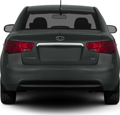 Rear view of sedan with taillights, rear window, and trunk