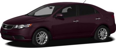 Side profile of a maroon compact sedan with alloy wheels and smooth contours