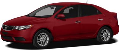 Red sedan side profile with alloy wheels