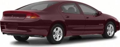 Rear side view of a maroon four-door sedan with alloy wheels