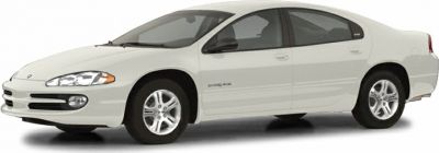 White four-door sedan showing front side profile with alloy wheels