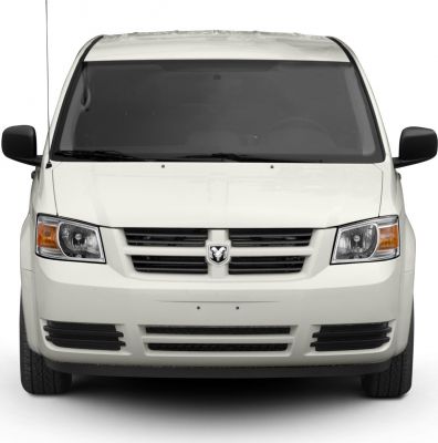 Front view of minivan with dual headlights, badge, black mirrors
