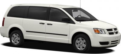 White minivan side view with sliding doors and alloy wheels
