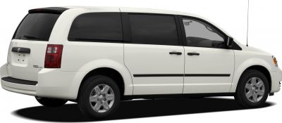 White minivan side and rear view with sliding door and tinted windows