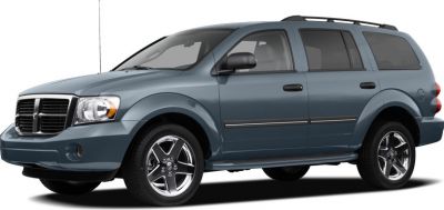 Front side view of a dark gray facelifted mid-size SUV with roof rails.
