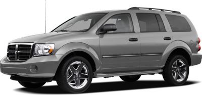 Front side view of a gray SUV with roof rack and alloy wheels