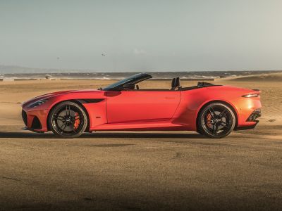 Side profile of convertible with aerodynamic design and sporty black rims