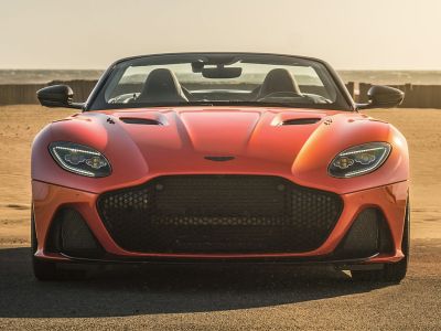 Sporty convertible front with wide honeycomb grille and LED headlights.