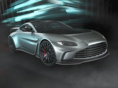 Front view of a sleek coupe with wide grille and aerodynamic splitter