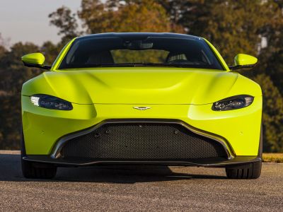 Front view of sleek headlights and bold grille