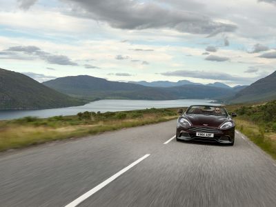Convertible luxury sports vehicle front view on scenic road