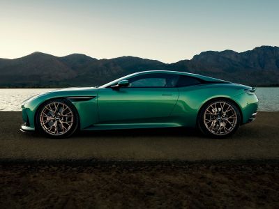 Side profile of a sleek 2024 coupe with distinctive alloy wheels