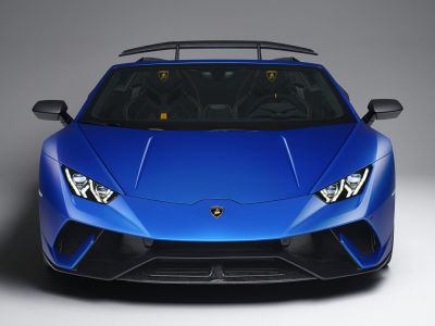Aggressive front view with sharp headlights and aerodynamic vents