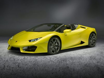 Yellow convertible sports car with sleek design and alloy wheels