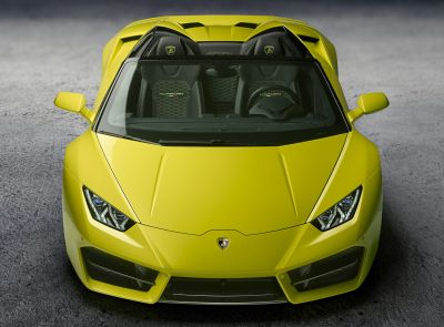 Front view of a yellow luxury convertible with sharp headlights