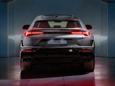 Rear view with full-width LED tail lights and quad exhaust pipes