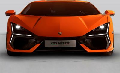 Angular hood and unique LED headlights on front view.