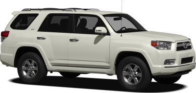 White mid-size SUV side view with roof rails and alloy wheels