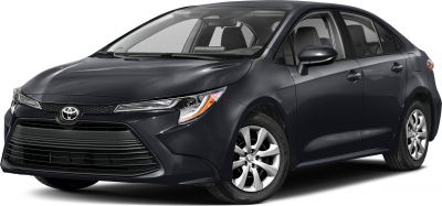 Sharp headlights and wide horizontal front grille on compact sedan
