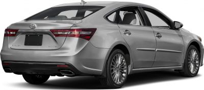 Rear side view with dual exhaust and alloy wheels
