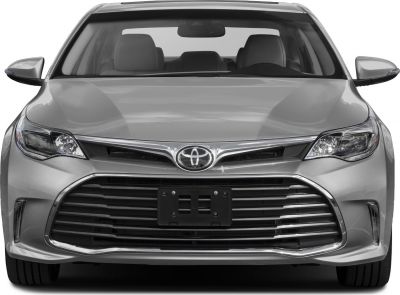 Wide chrome-accented grille and sleek headlights front view.