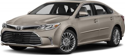 Front grille and side profile of a beige luxury sedan