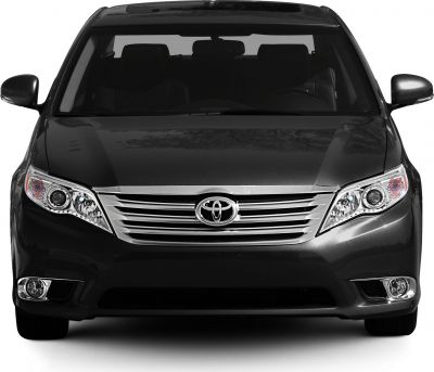 Sleek front view with chrome grille and headlight design